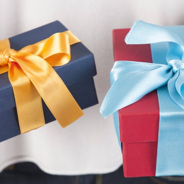 Gift boxes from a corporate rewards program on a table