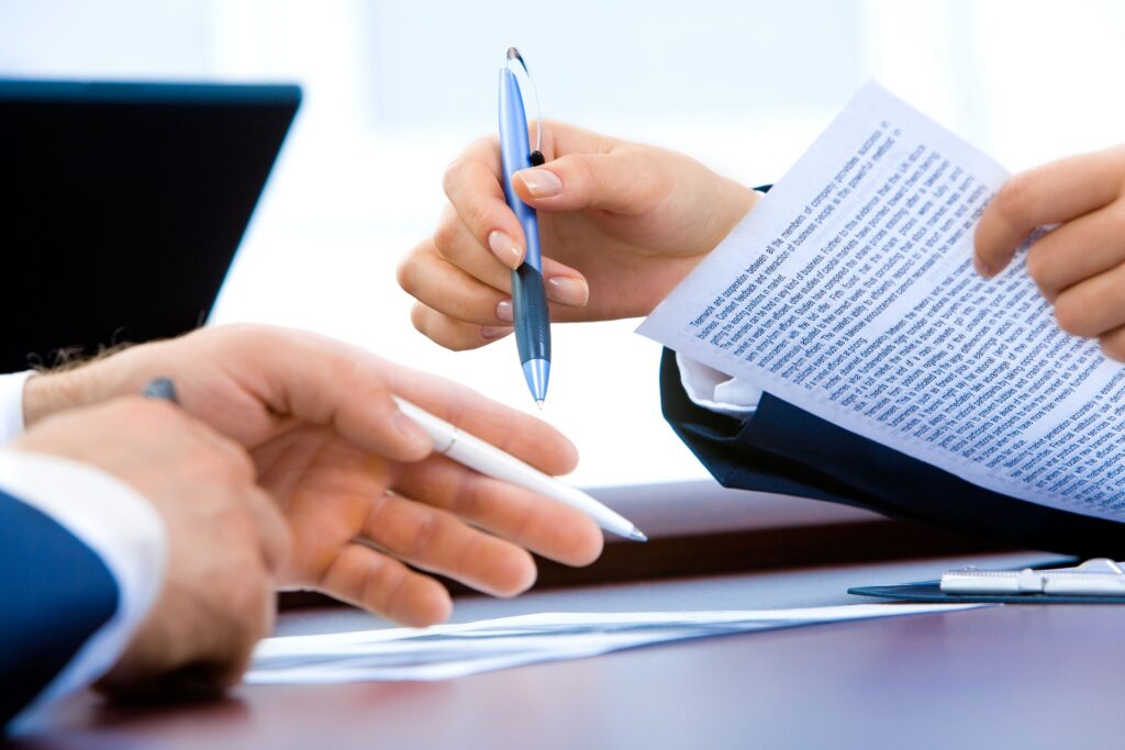 Two people looking over a vendor incentive document