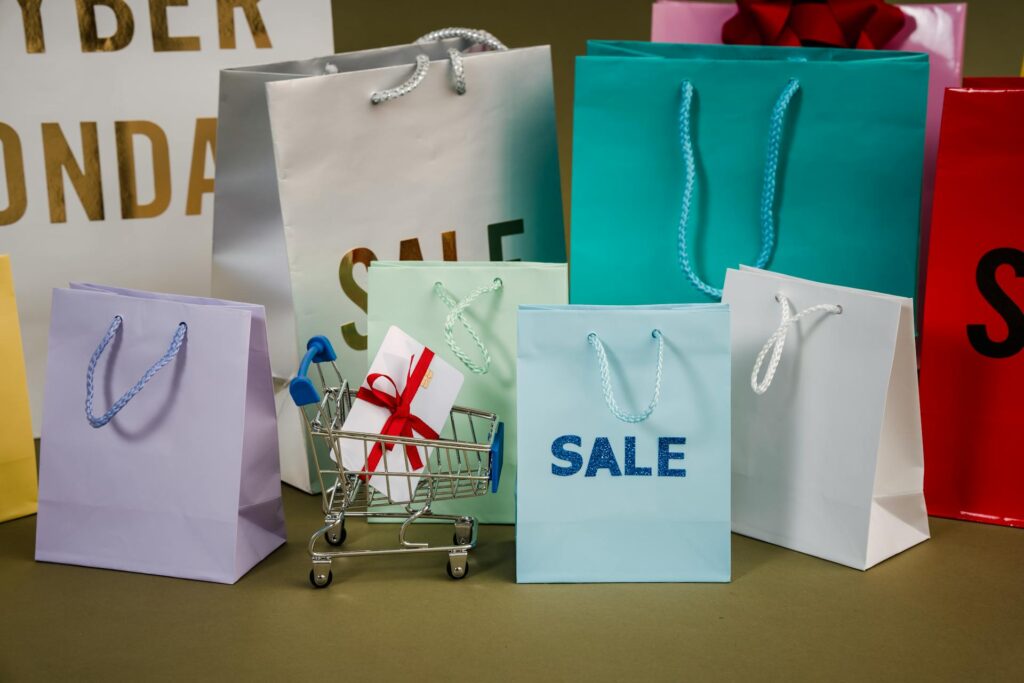 Shopping cart with a gift card surrounded by gift bags