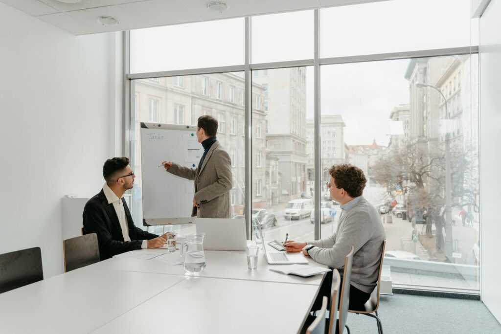 Team sitting at conference table and brainstorming