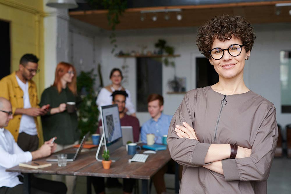 A person standing in front of a team working on a rewards API