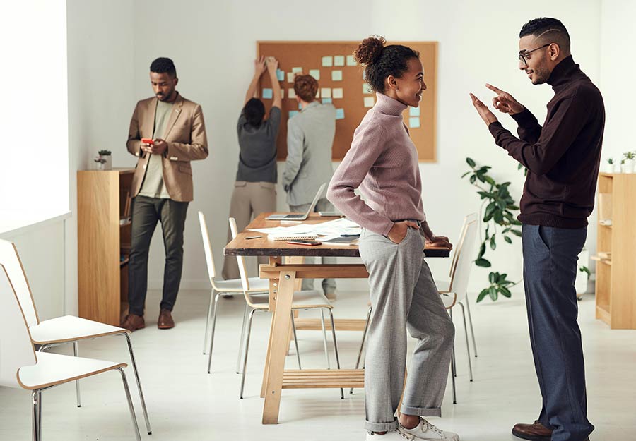 Employees discussing work in a meeting