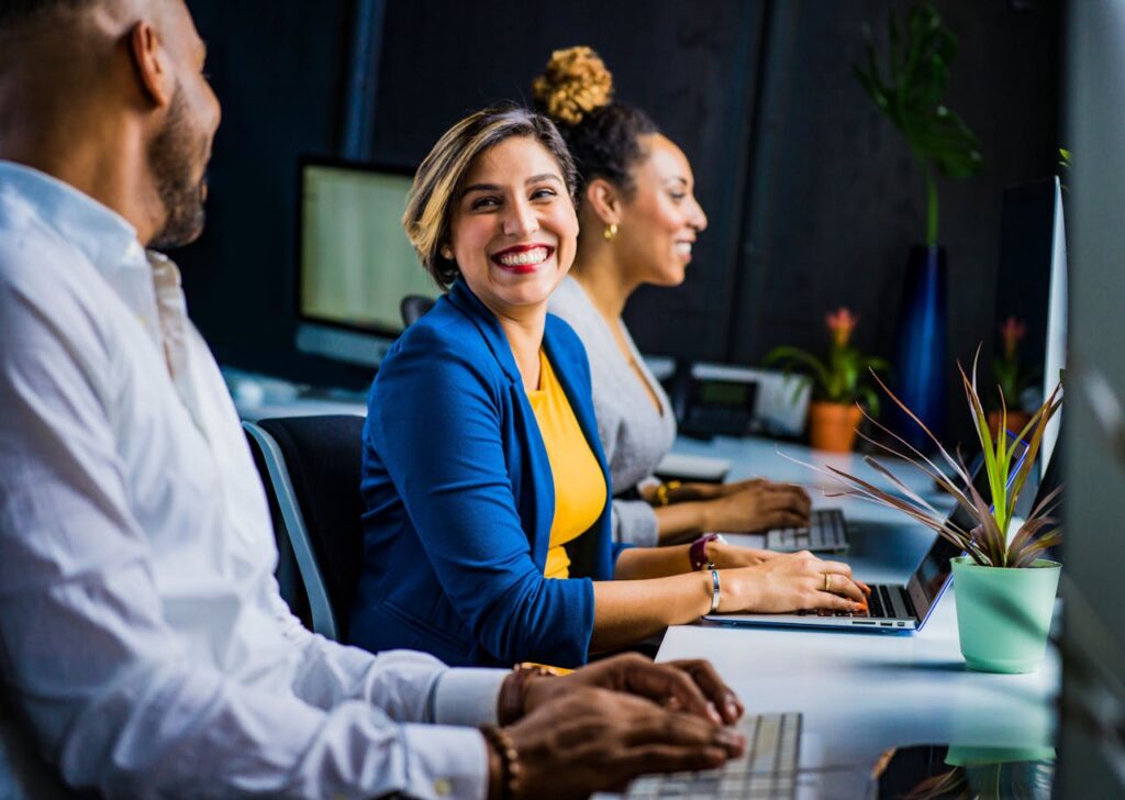 A group of employees discussing channel incentive programs