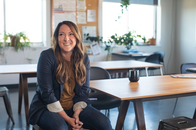 A happy woman thinking about her company’s loyalty marketing program