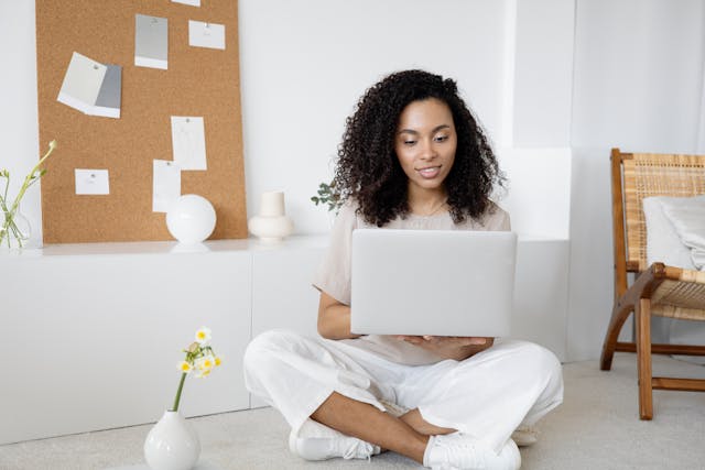 A person accessing promotion software on a laptop