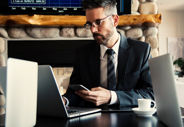 A man accessing sales incentive software on a laptop