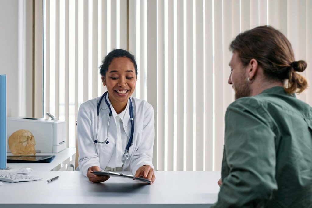 A person speaking with a doctor to understand which prepaid card is the best