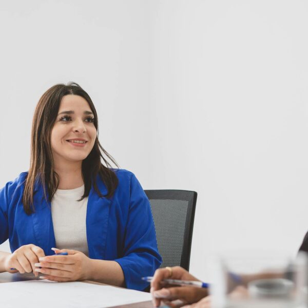 Two employees sitting down and discussing B2B loyalty programs